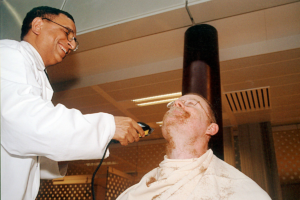 Ajit Manocha as a barber