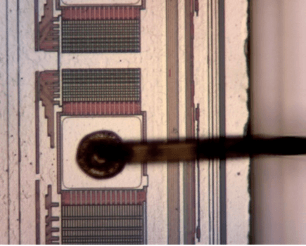 . Optical microscope image on the 1st layer (a) and the 2nd layer of flash memory stacked die (b) in the SiP module after MIP decapsulation